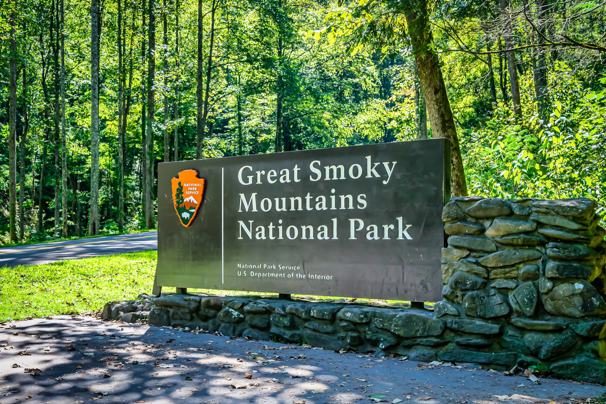 Great Smoky Mountains National Park entrance sign surrounded by forest
